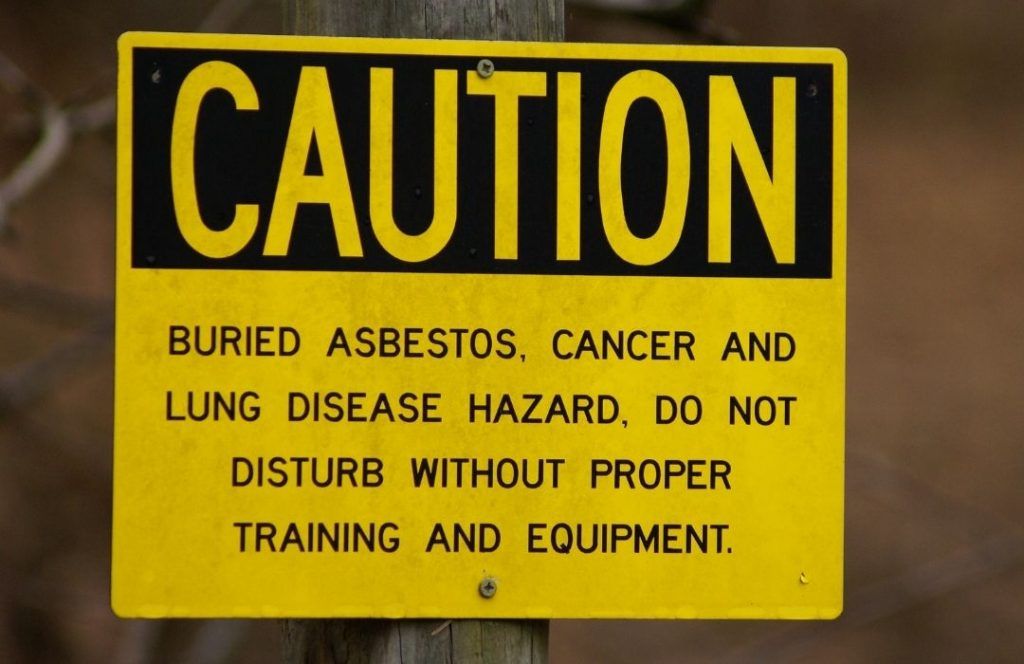 Asbestos caution sign | Featured Image For What Are Asbestos Exposure Symptoms? - Asbestos Poisoning Symptoms Blog from Asbestos Removals Brisbane.
