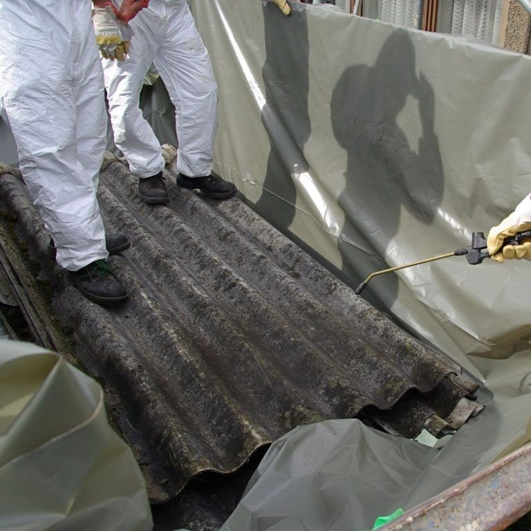 Asbestos workers using their equipment to remove asbestos from a roof | Featured image for Asbestos Mines - Asbestos Related Diseases Blog from Asbestos Removals Brisbane.