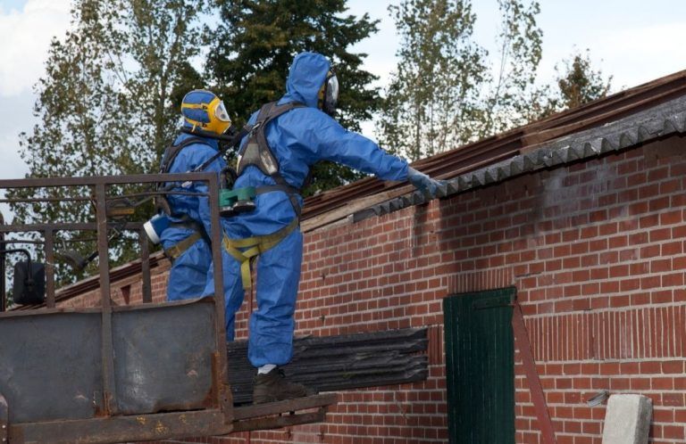 Workers removing asbestos from the roof | When does asbestos become dangerous